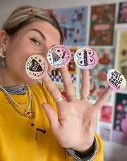 Women holding colorful Munbyn labels on a finger with a colorful background