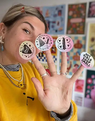 Women holding colorful Munbyn labels on a finger with a colorful background