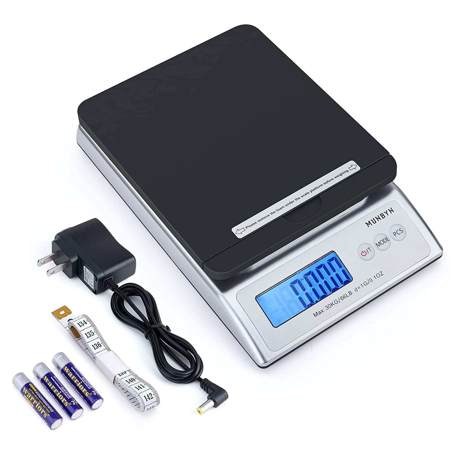 MUNBYN's black digital postal scale comes with a charging head, three batteries, and a tape measure.